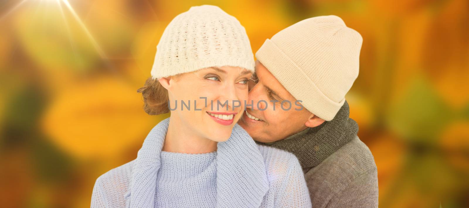 Casual couple in warm clothing against autumn scene