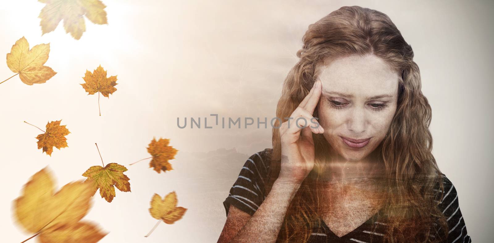 Blonde woman having headache against autumn leaves pattern