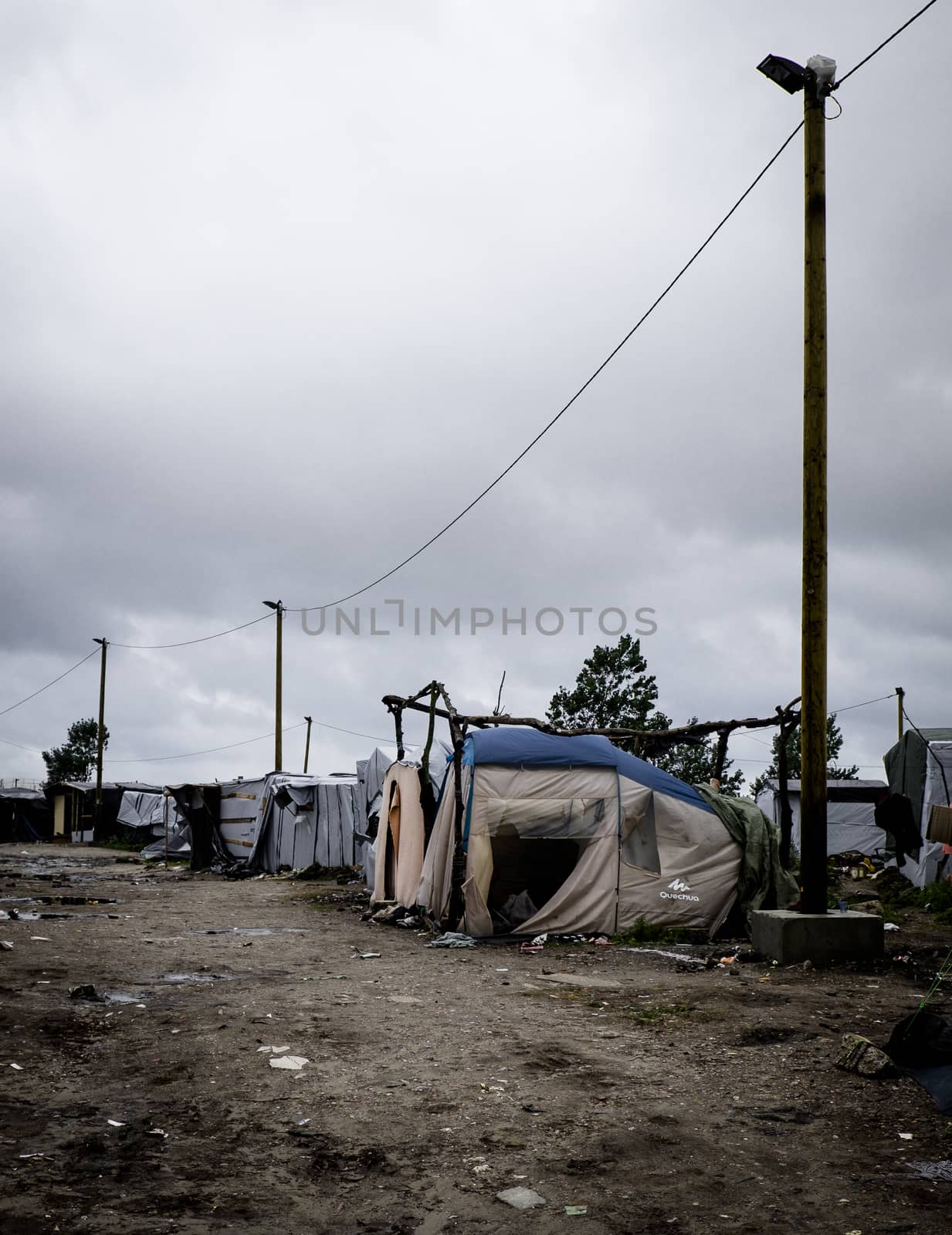 FRANCE, Calais: An empty street is seen at the New Jungle refugee and migrant camp near Calais, France, on September 17, 2015.	Refugees and migrants trying to enter the UK from France are facing dropping temperatures and poor sanitation at the makeshift camp.