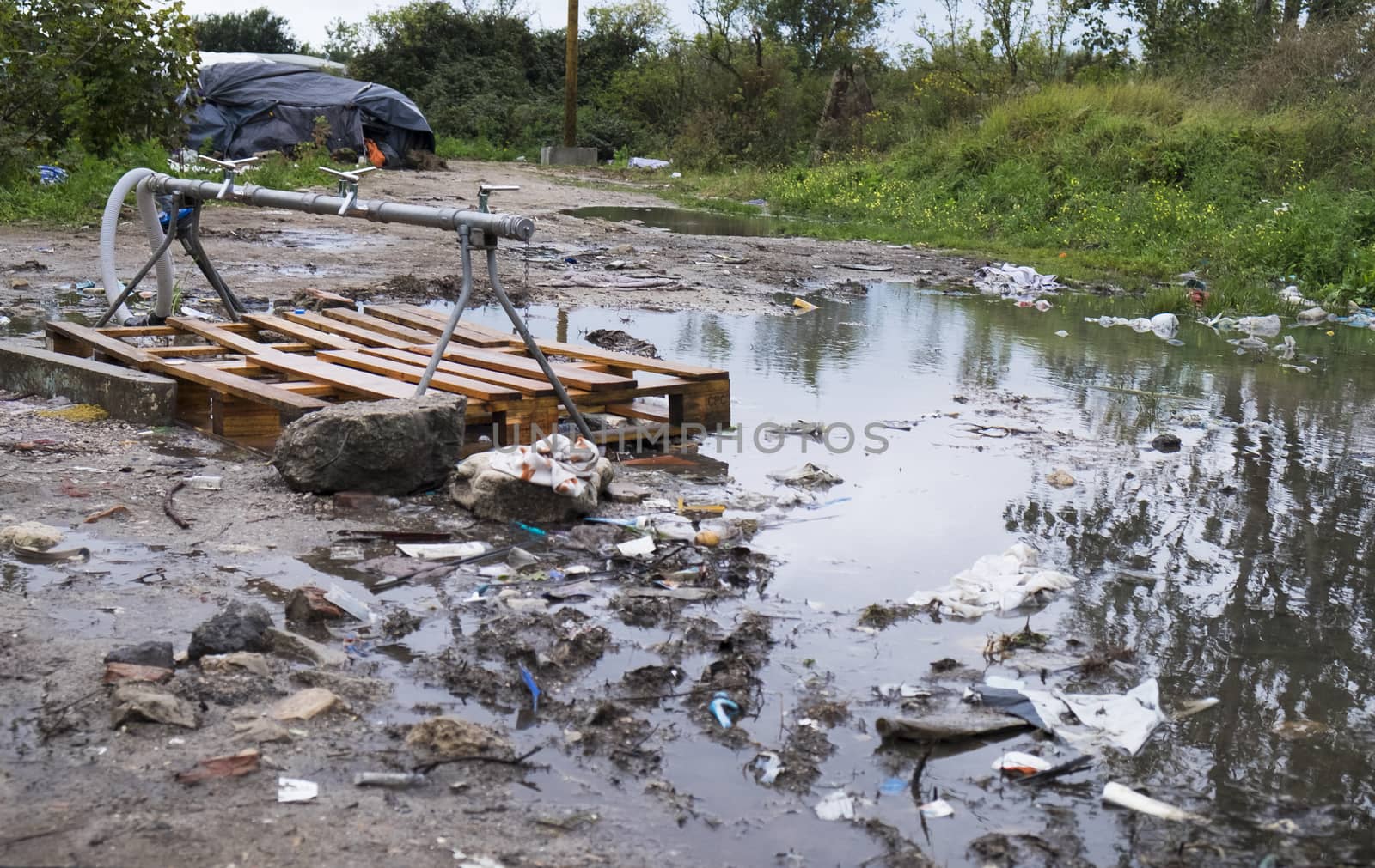 FRANCE, Calais: The main fersh water source at at the New Jungle refugee and migrant camp near Calais, France, on September 17, 2015.	Refugees and migrants trying to enter the UK from France are facing dropping temperatures and poor sanitation at the makeshift camp.