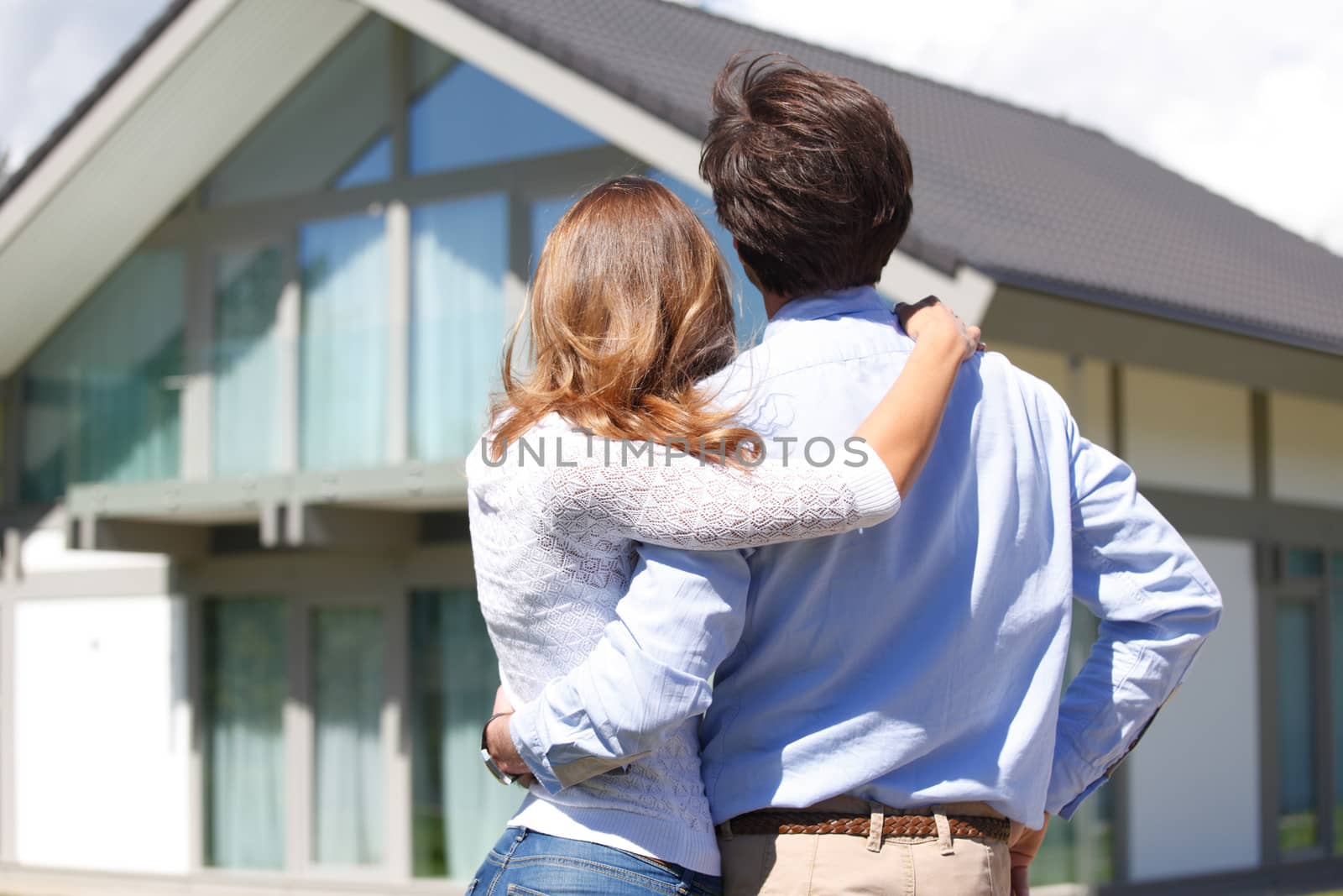 young couple looking at the house