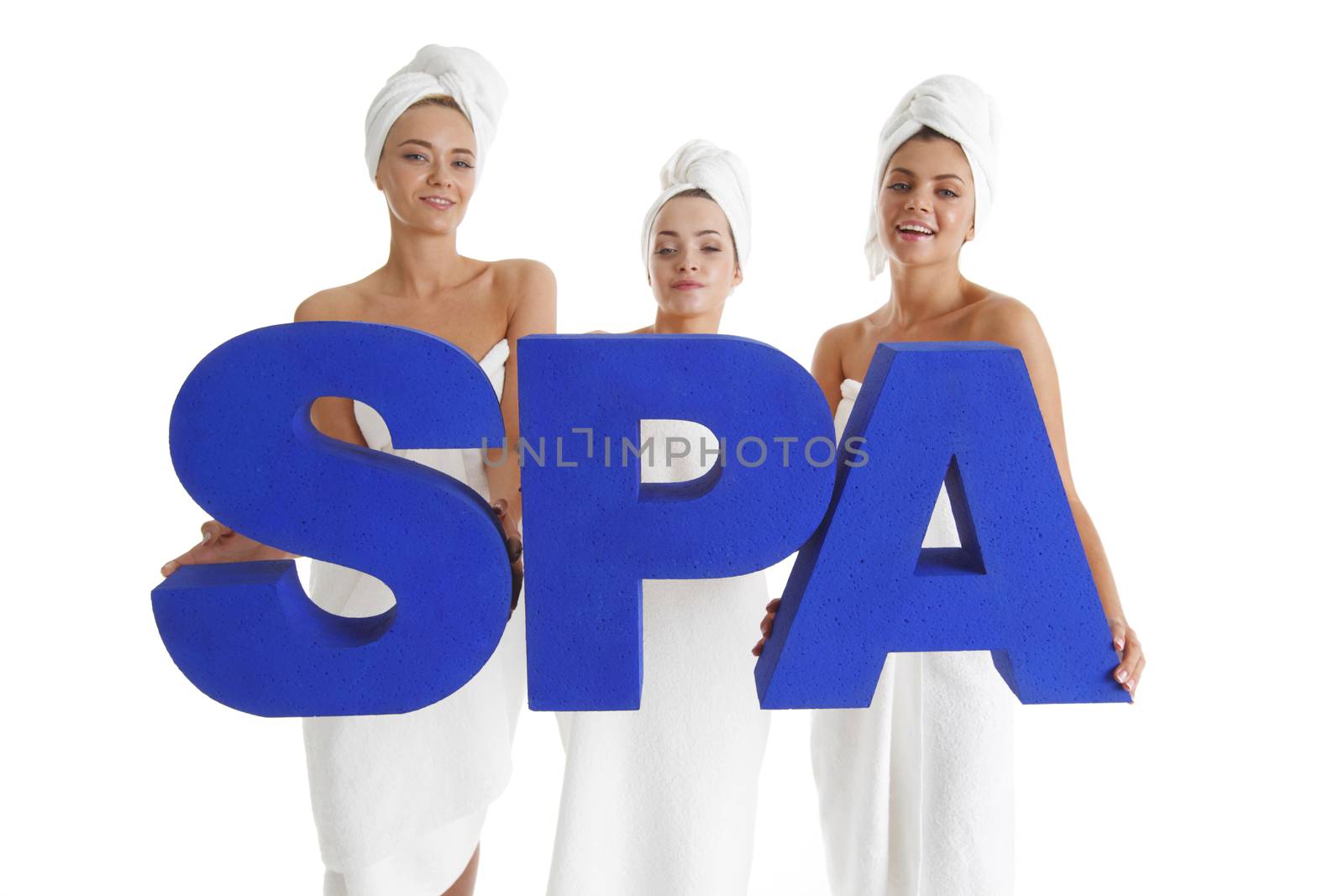 Women wrapped in towels holdin SPA letters isolated on white background