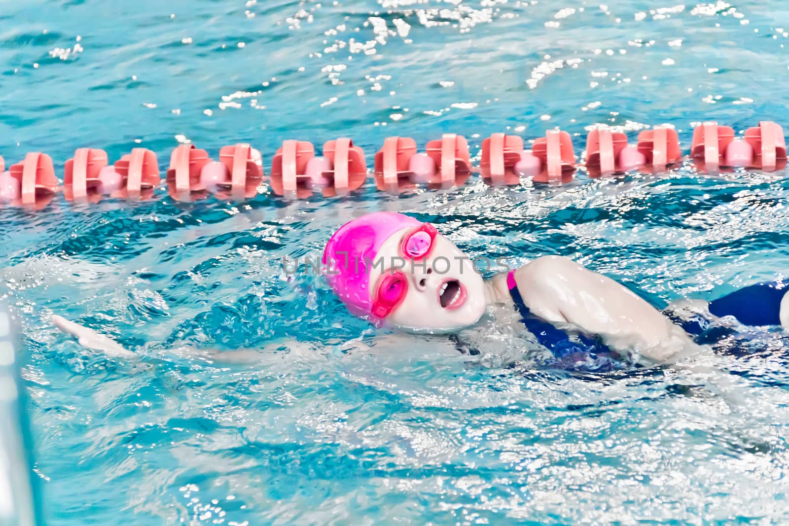 Photo of cute girl in swimming pool