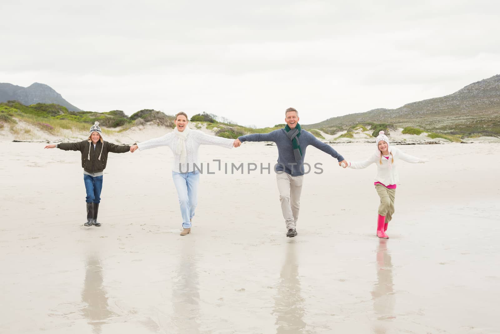 Happy family enjoying a nice day out at the beach