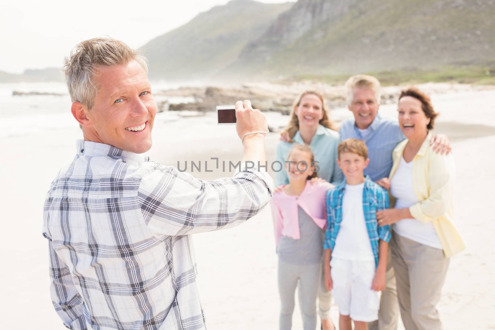 Multi generation family taking a picture by Wavebreakmedia