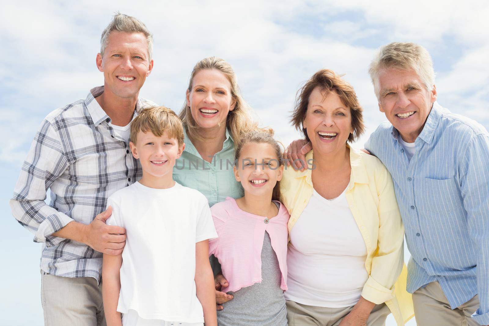 Multi generation family happy and smiling at the beach