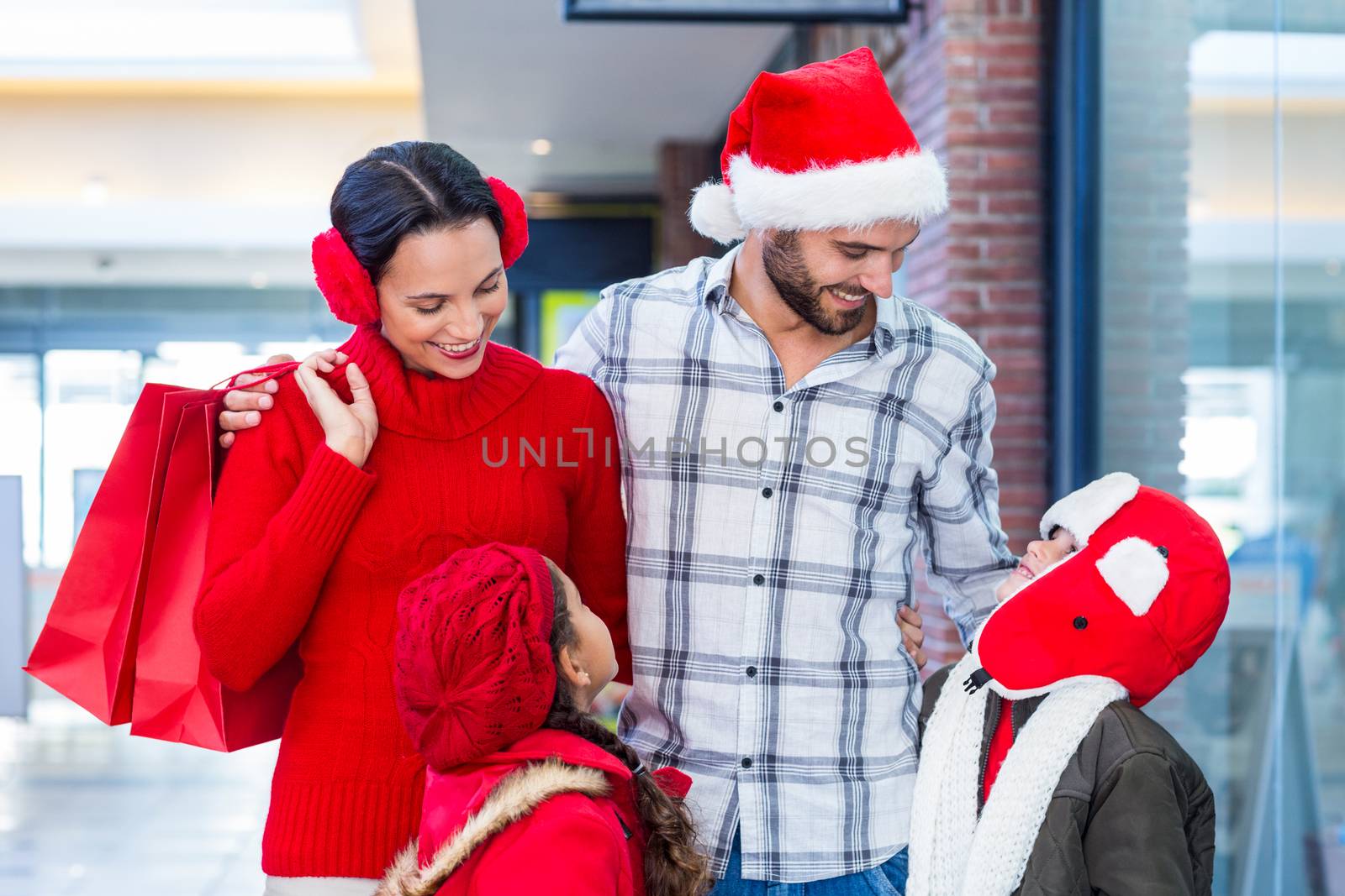 Happy family looking at each other in the mall