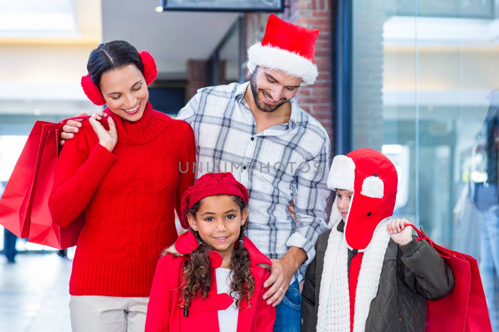 Happy family looking at each other in the mall