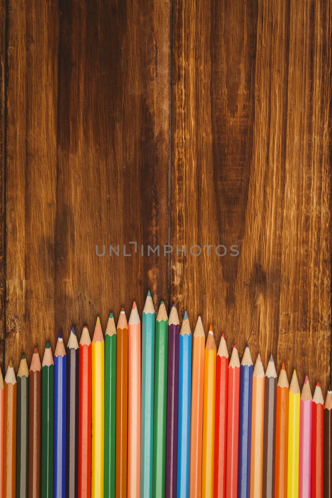 Colour pencils on desk with copy space by Wavebreakmedia