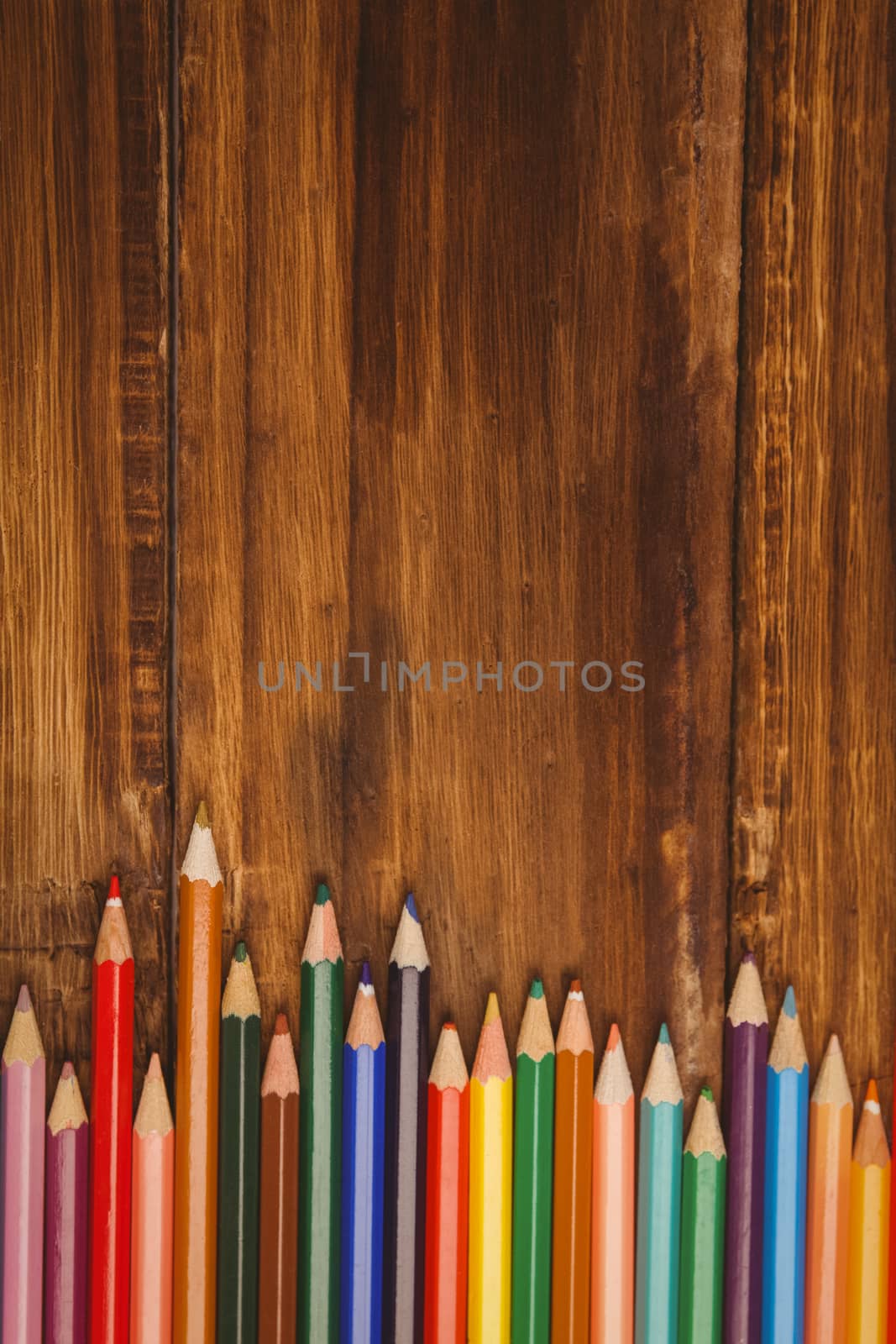 Colour pencils on desk with copy space by Wavebreakmedia