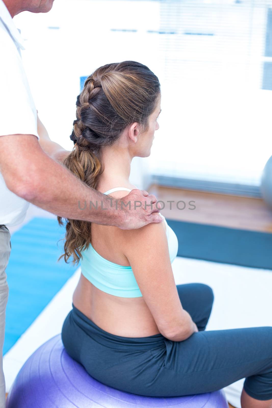 Pregnant woman having relaxing massage at gym by Wavebreakmedia