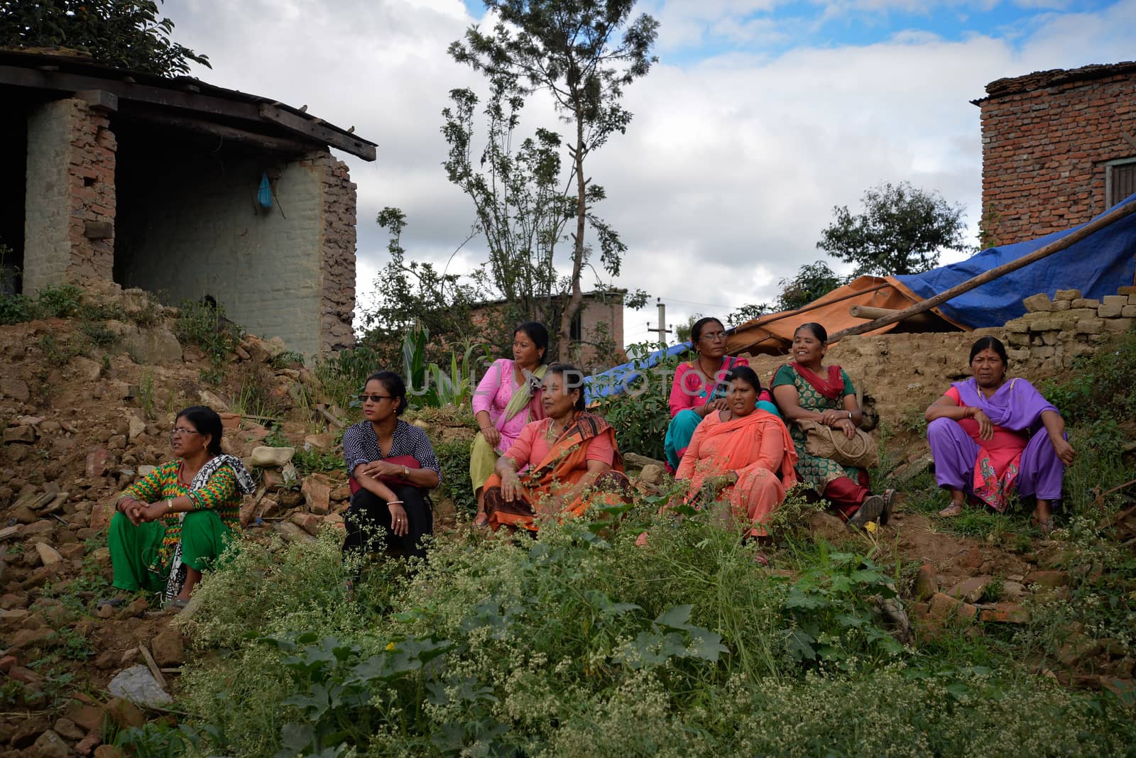 NEPAL, Patan: Nepalese women take rest during the festival of rain god Rato Machindranath in Patan, Nepal on September 22, 2015. The festival takes place each April, but was delayed this year after a devastating earthquake damaged the chariot that devotees pull through the area in the hope of securing a good harvest.