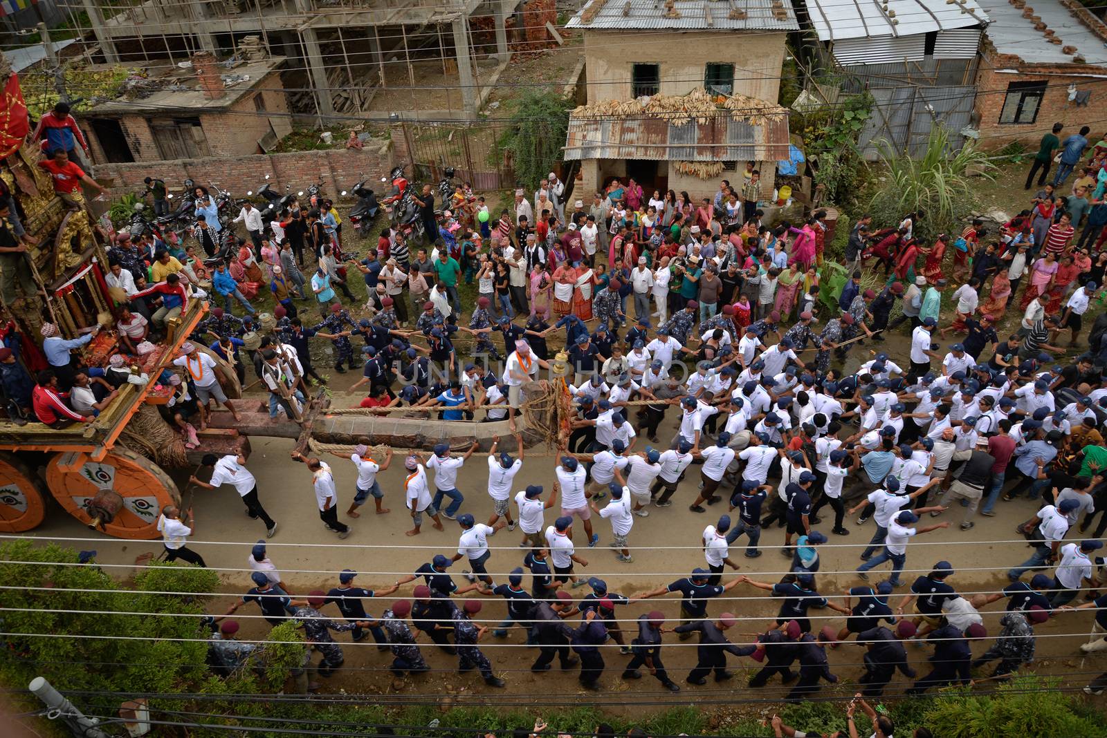 NEPAL, Patan: Hindu and Buddhist devotees celebrate the festival of rain god Rato Machindranath in Patan, Nepal on September 22, 2015. The festival takes place each April, but was delayed this year after a devastating earthquake damaged the chariot that devotees pull through the area in the hope of securing a good harvest.