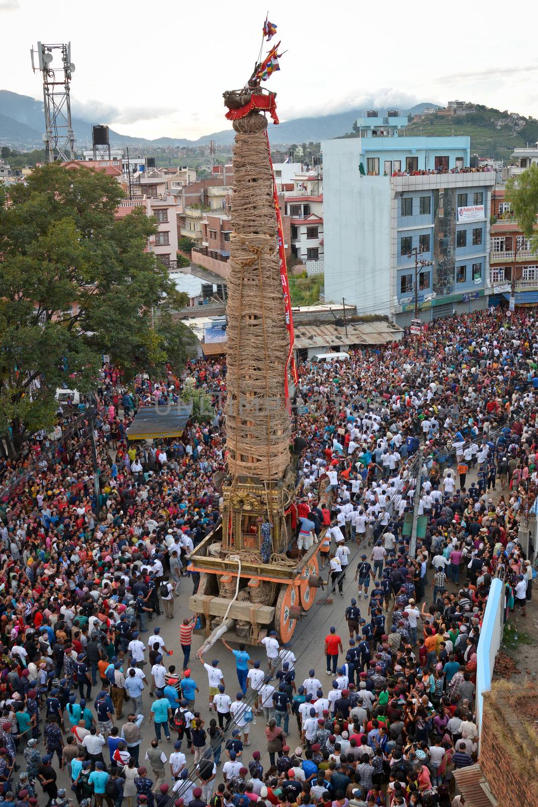 NEPAL, Patan: The restored chariot makes its way through Patan, Nepal as Hindu and Buddhist devotees celebrate the festival of rain god Rato Machindranath on September 22, 2015. The festival takes place each April, but was delayed this year after a devastating earthquake damaged the chariot that devotees pull through the area in the hope of securing a good harvest.