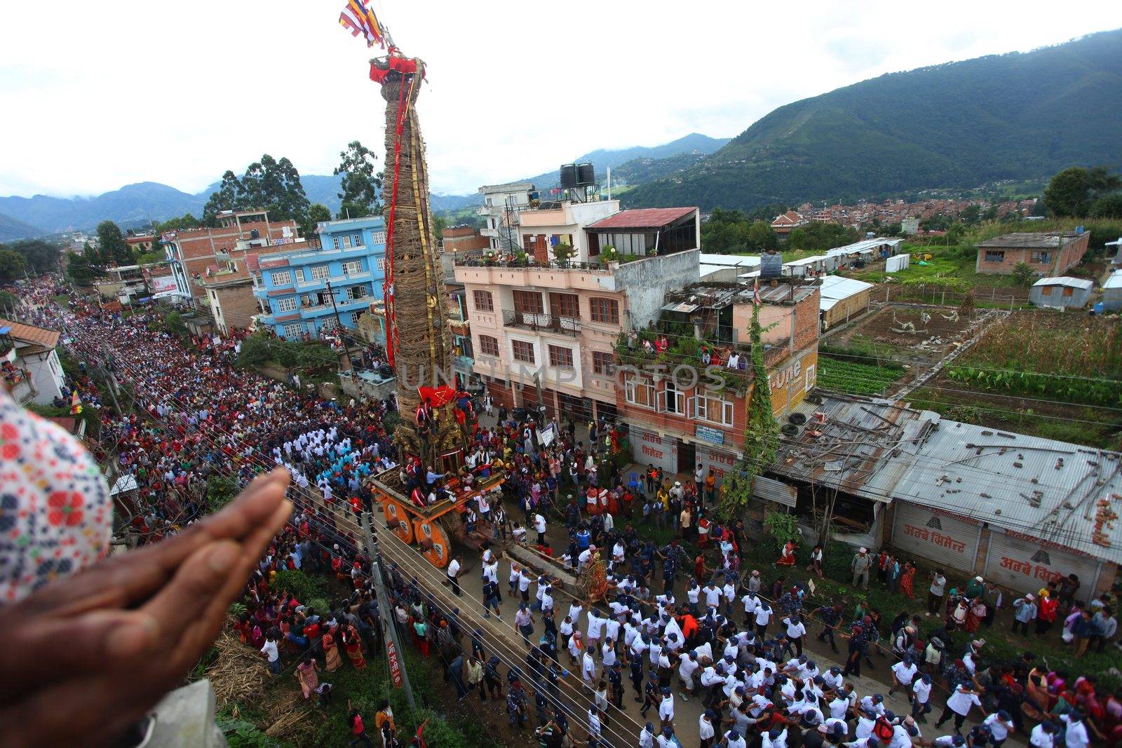 NEPAL, Patan: The restored chariot makes its way through Patan, Nepal as Hindu and Buddhist devotees celebrate the festival of rain god Rato Machindranath on September 22, 2015. The festival takes place each April, but was delayed this year after a devastating earthquake damaged the chariot that devotees pull through the area in the hope of securing a good harvest.