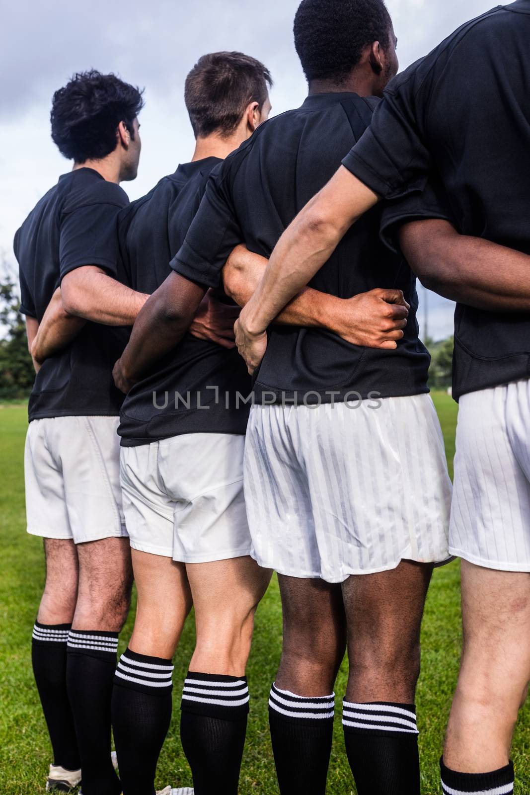 Rugby players standing together before match at the park