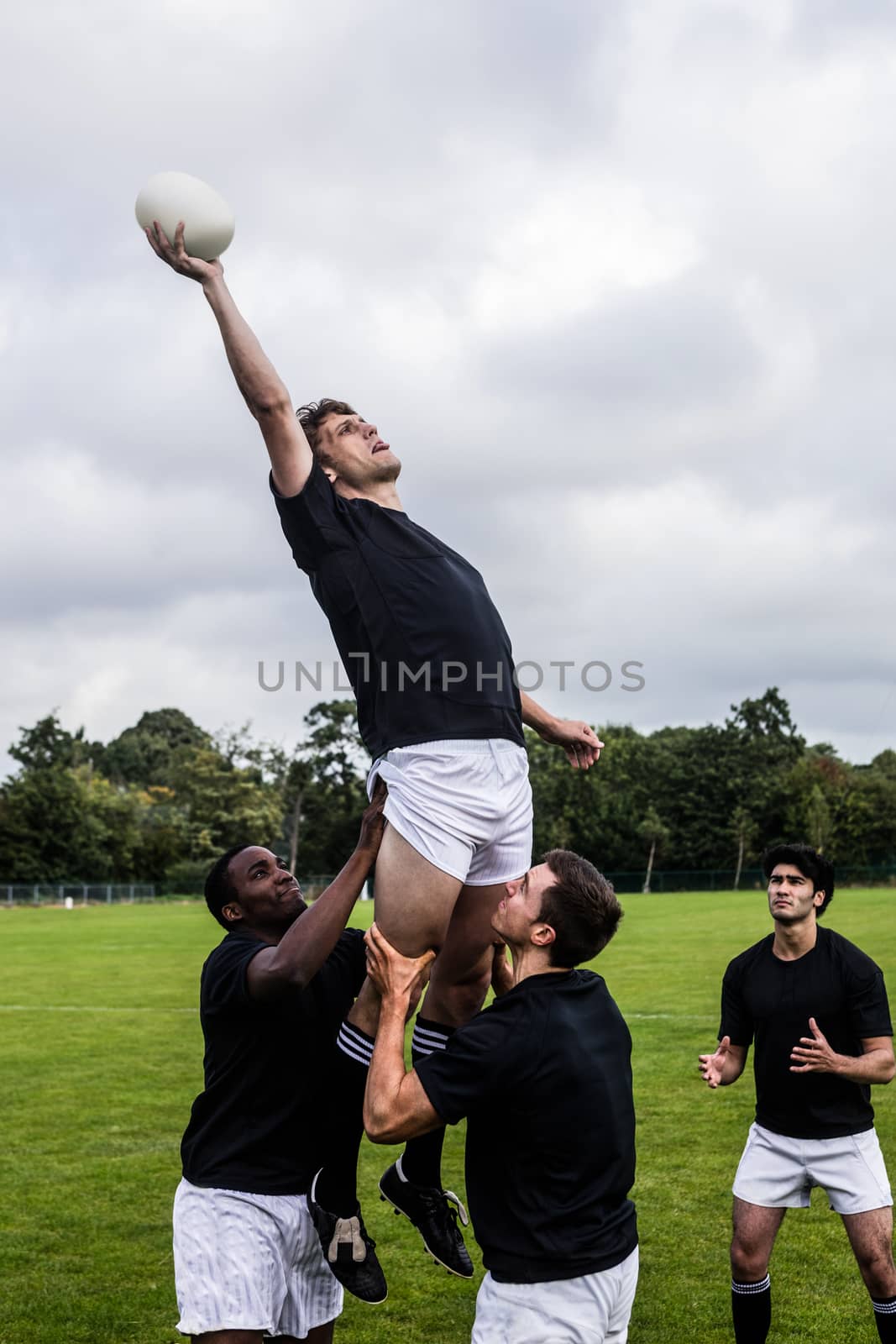 Rugby players jumping for line out by Wavebreakmedia