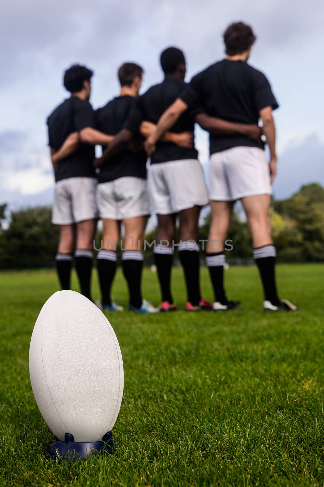 Rugby players standing together before match at the park