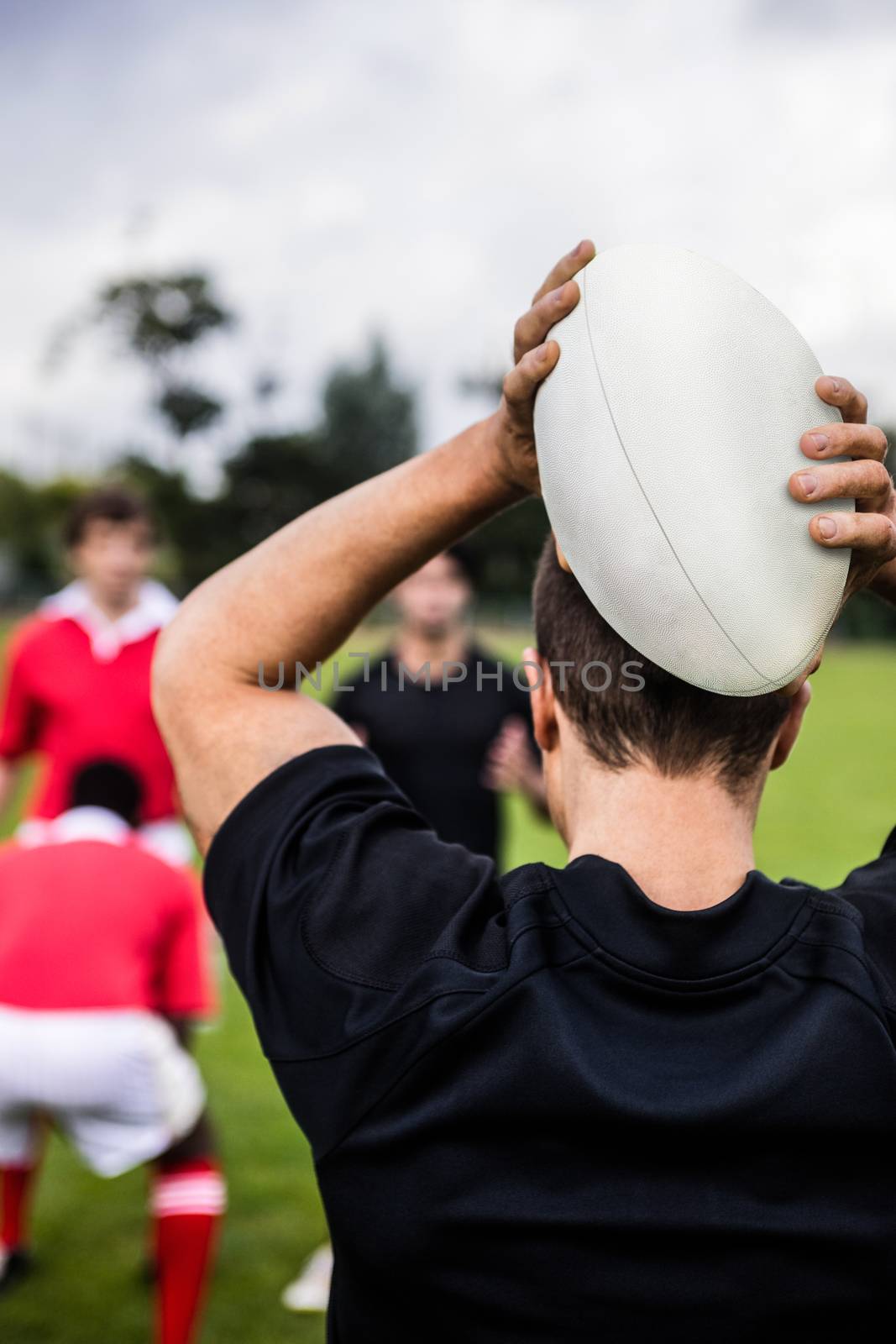 Rugby players training on pitch by Wavebreakmedia