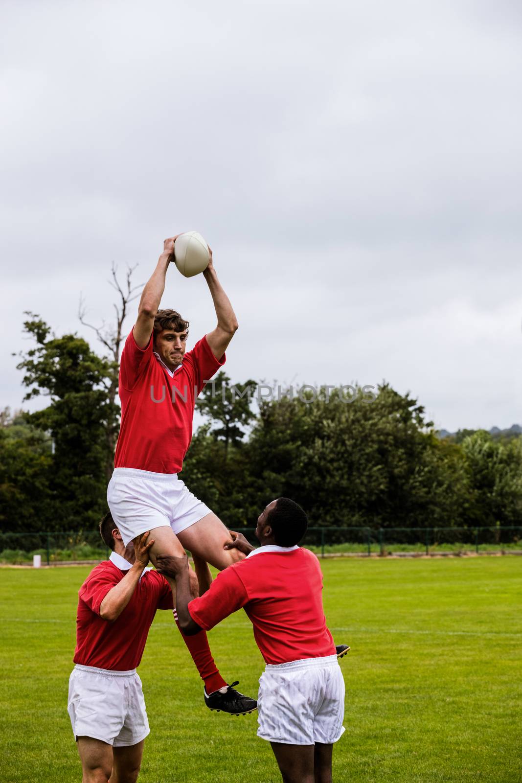 Rugby players jumping for line out by Wavebreakmedia