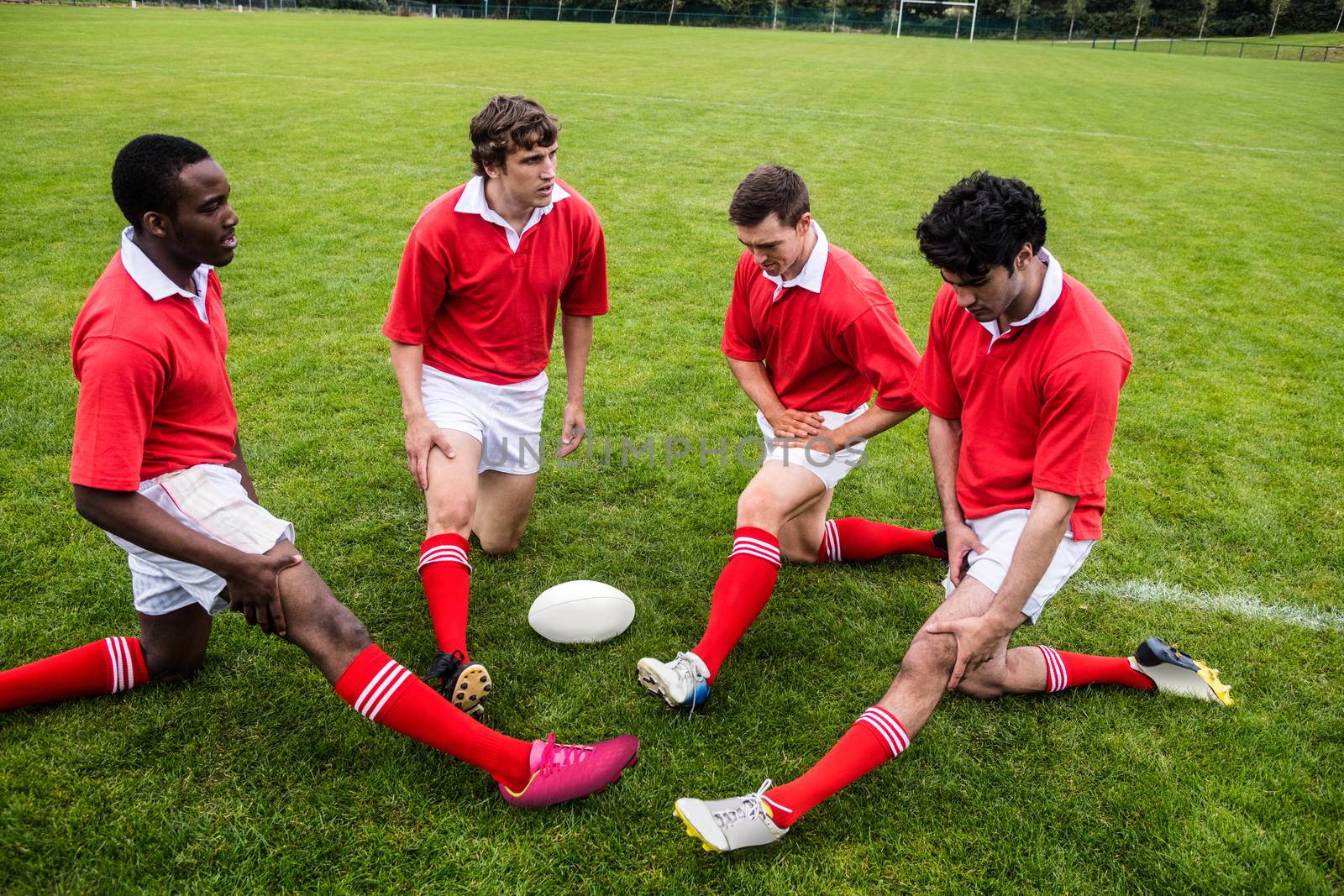 Rugby players warming up before match by Wavebreakmedia