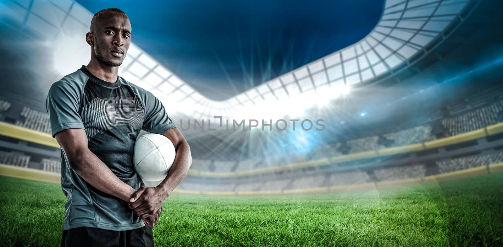 Composite image of portrait of confident sportsman with rugby ball by Wavebreakmedia