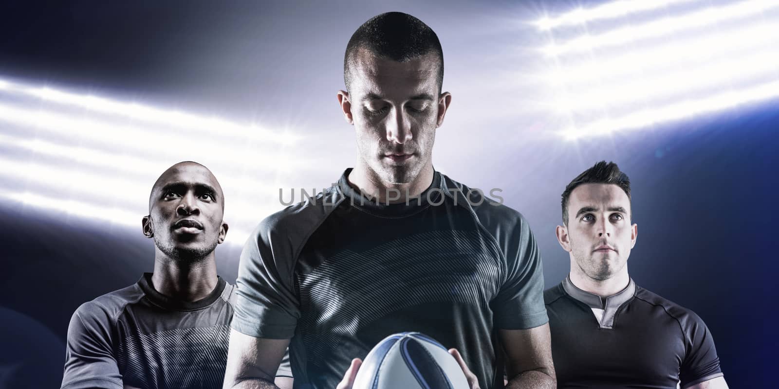 Composite image of thoughtful rugby player holding ball by Wavebreakmedia