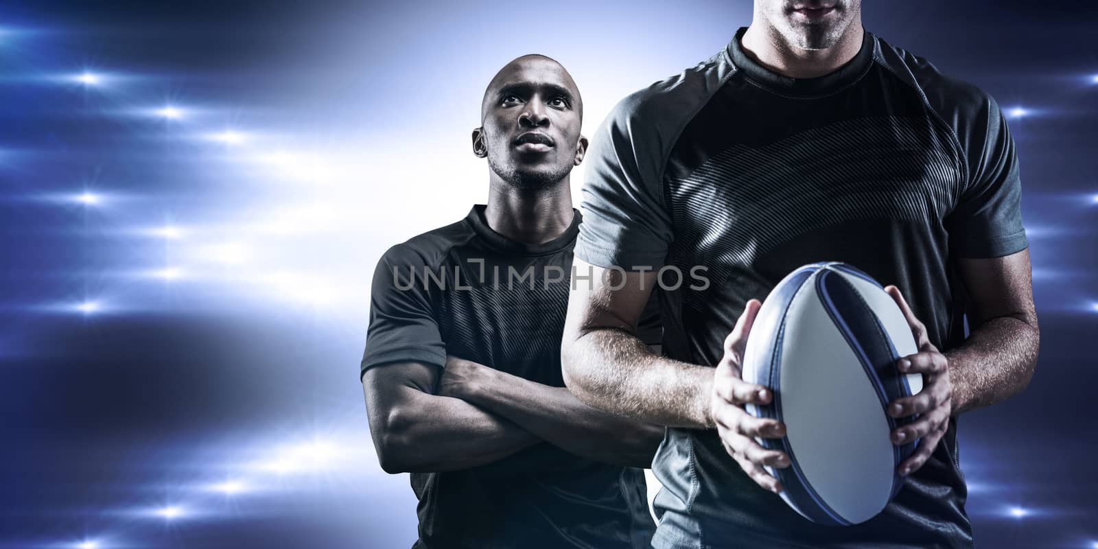 Composite image of thoughtful rugby player holding ball by Wavebreakmedia
