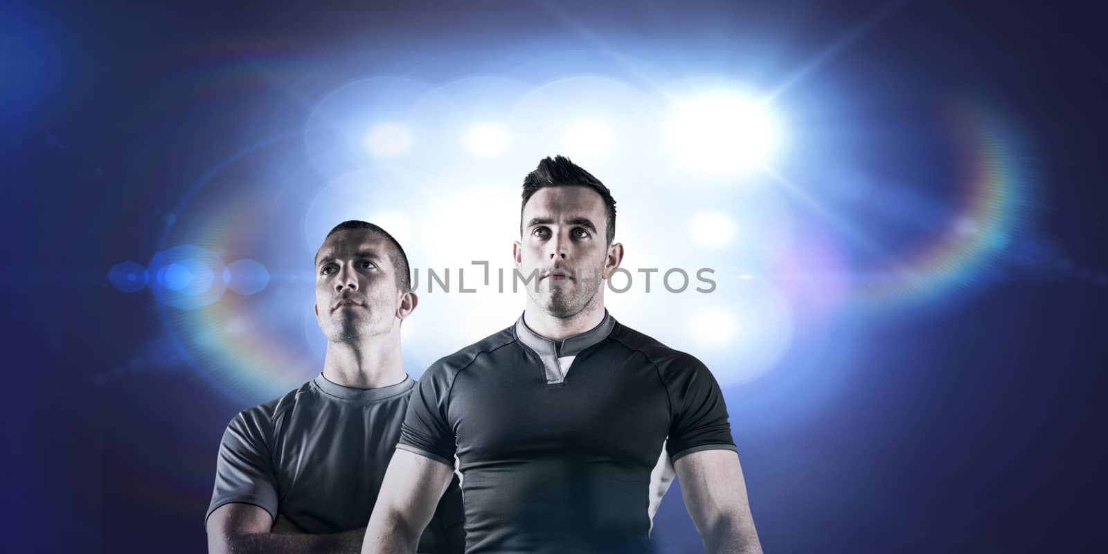 Composite image of tough rugby player holding ball by Wavebreakmedia