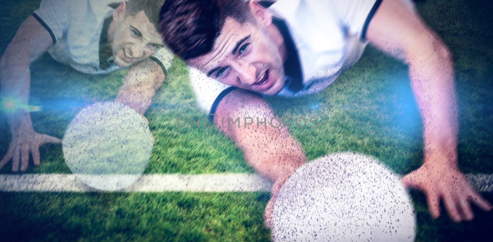 Composite image of man holding rugby ball while lying down by Wavebreakmedia