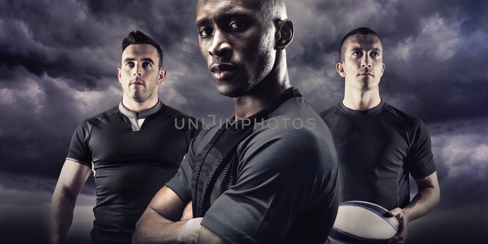 Portrait of confident athlete with arms crossed against stormy sky