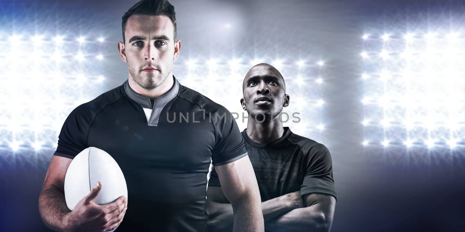 Composite image of tough rugby player holding ball by Wavebreakmedia