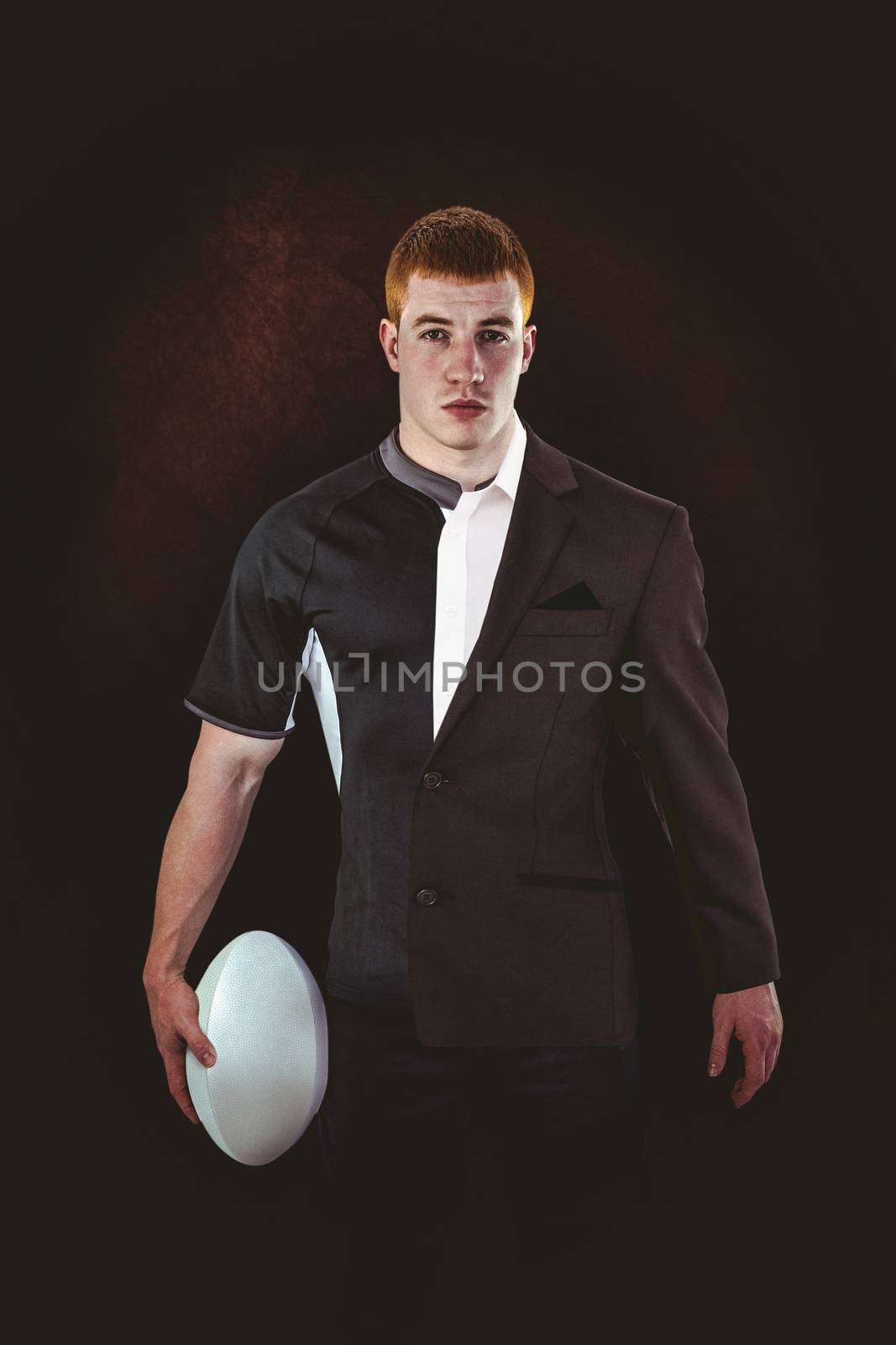 Composite image of rugby player holding a rugby ball by Wavebreakmedia