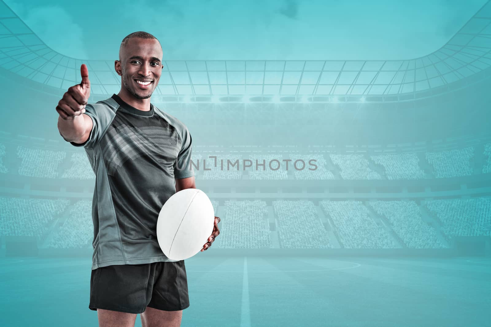 Portrait of confident rugby player smiling and showing thumbs up against blue vignette background