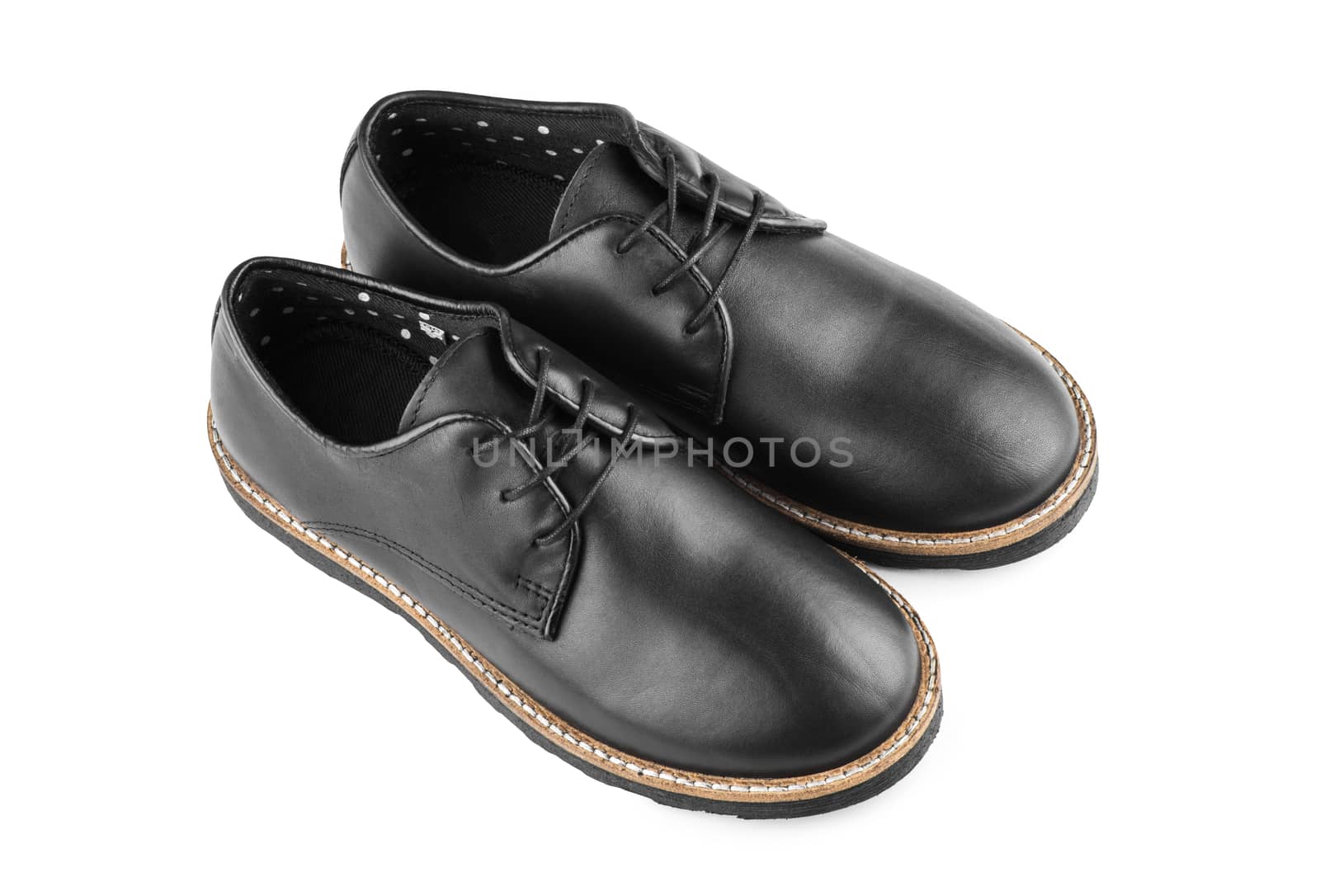 Male classic black leather stylish shoes with laces close up, top view