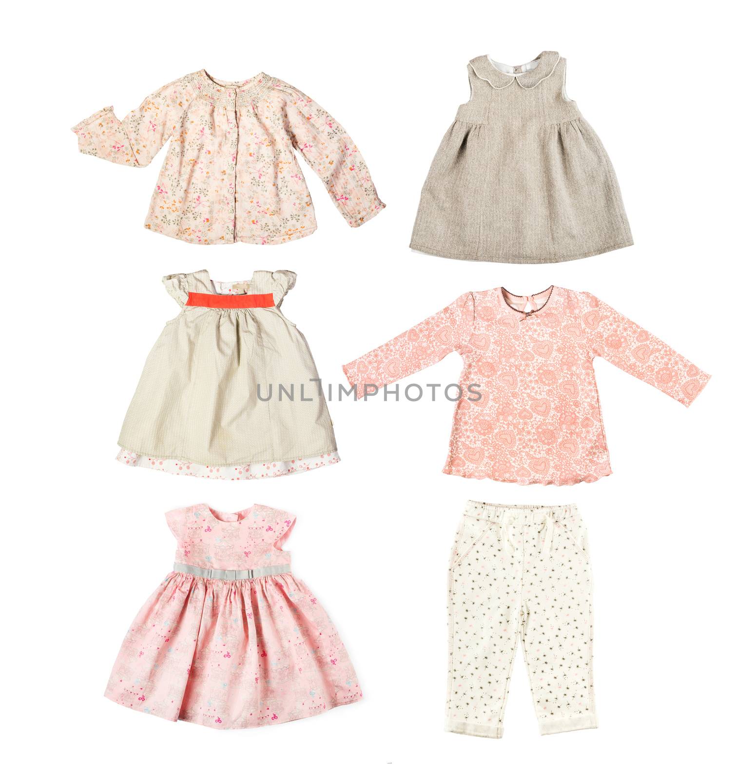 Set of different children's clothes, shirts, pants, dresses, baby's wardrobe isolated on white background