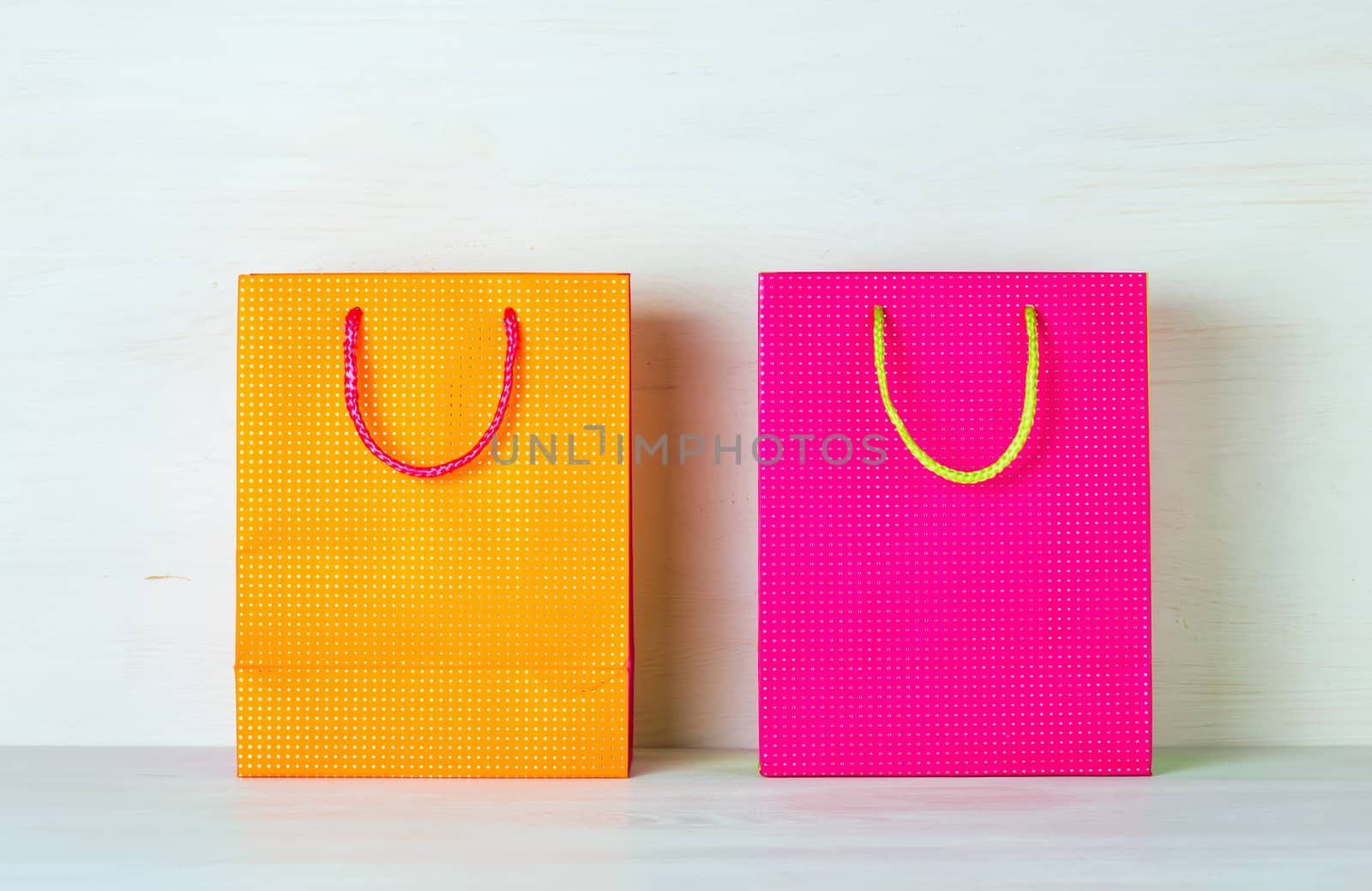 Two bright multicolored shopping bags  by iprachenko