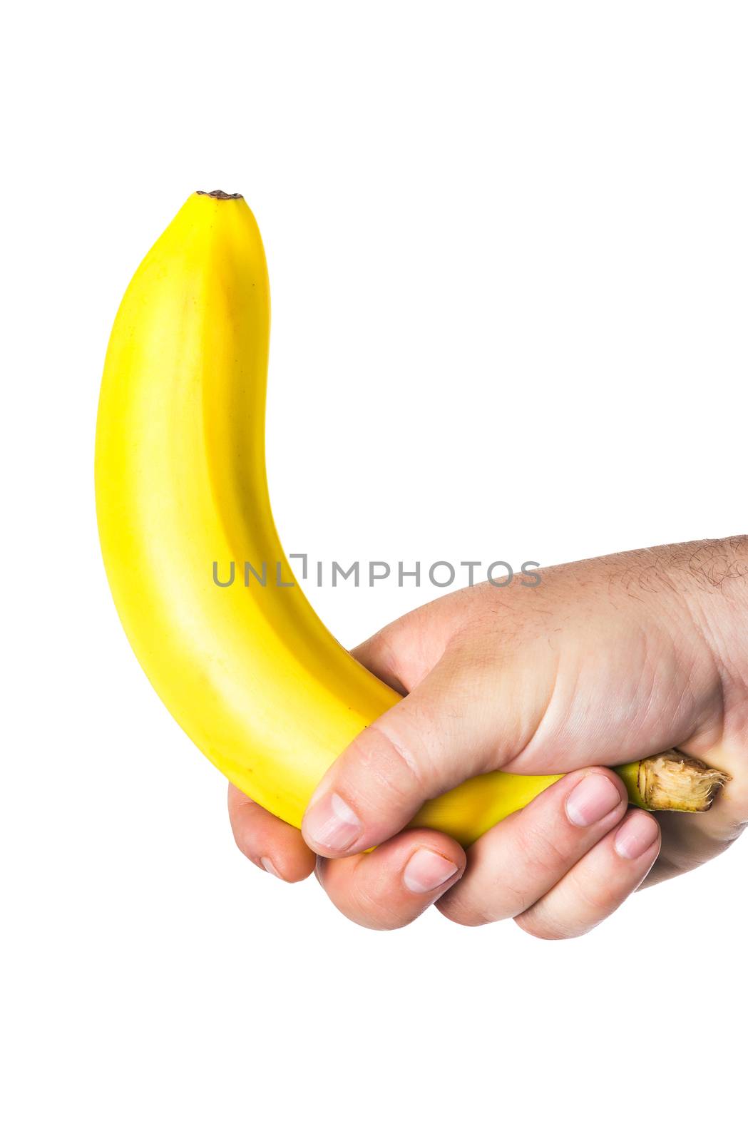 man's hand holding a banana like a big penis that symbolizes erection and potency