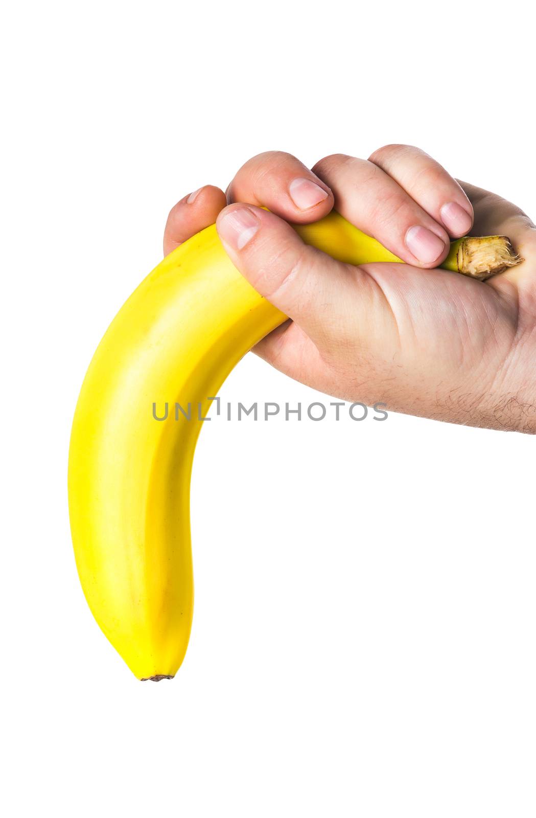 man's hand holding a banana like a big penis upside down that symbolizes lack of erection and impotence