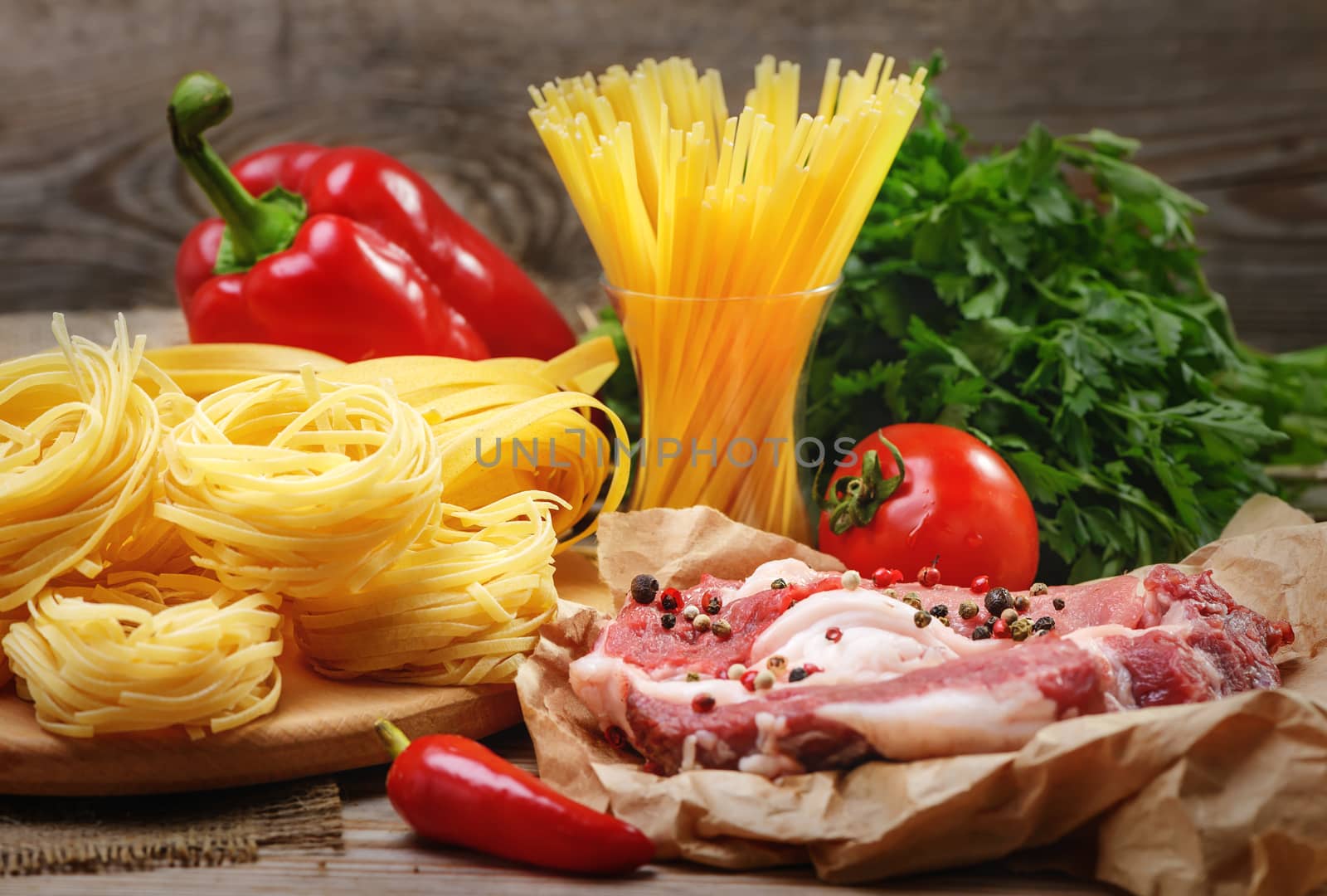 Ingredients for cooking pasta, Italian food, meat and spices, tomato, bell pepper