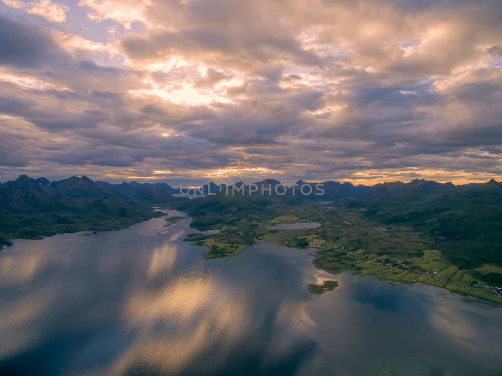 Evening skies above Vesteralen islands with their dramatic mountain peaks, scenic aerial view