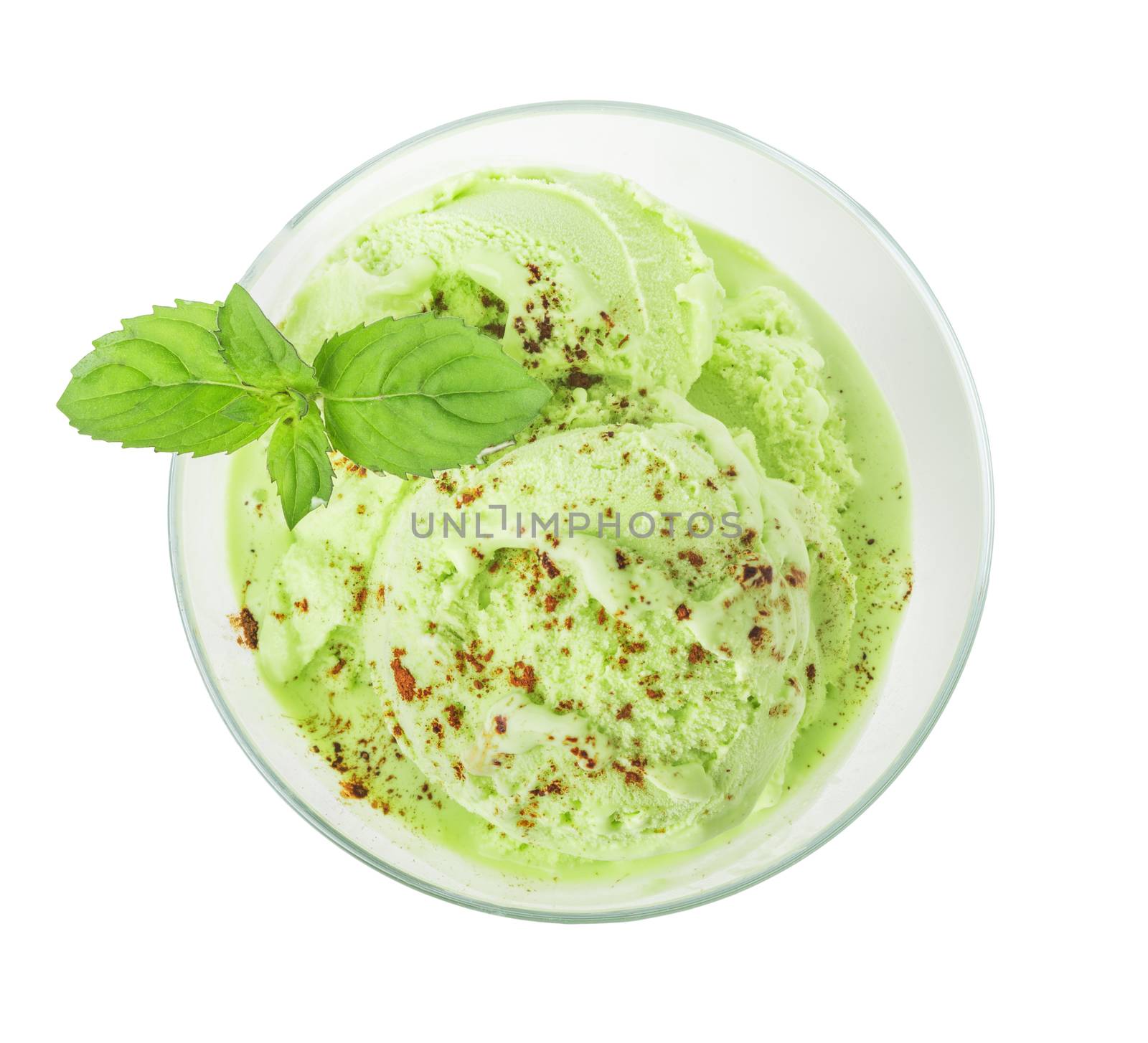 Green mint or pistachio ice cream and a sprig of fresh mint closeup, top view, isolated on white background