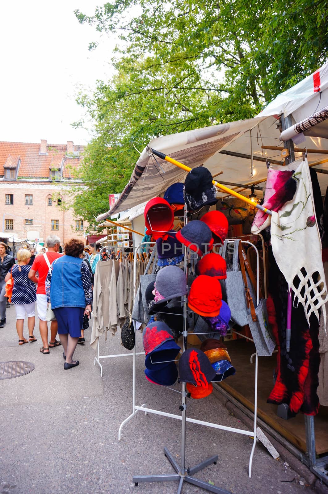 GDANSK, POLAND - JULY 29, 2015: Clothes and hats for sale at a market