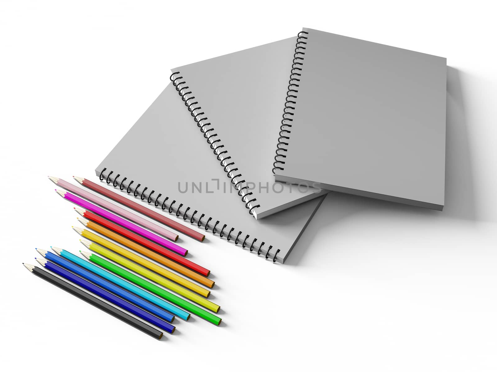 notebook with colored pencils on White background, stationary object