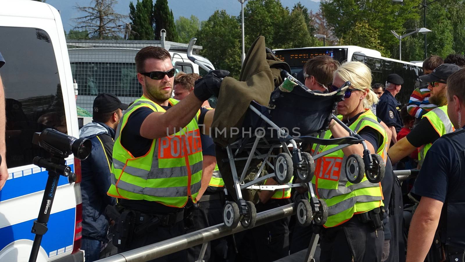 AUSTRIA, Salzburg: Scores line up at the border control in Salzburg, Austria on September 22, 2015 amid an ongoing refugee crisis, which has seen thousands flee from Syria and other war-torn countries for safety in Europe.