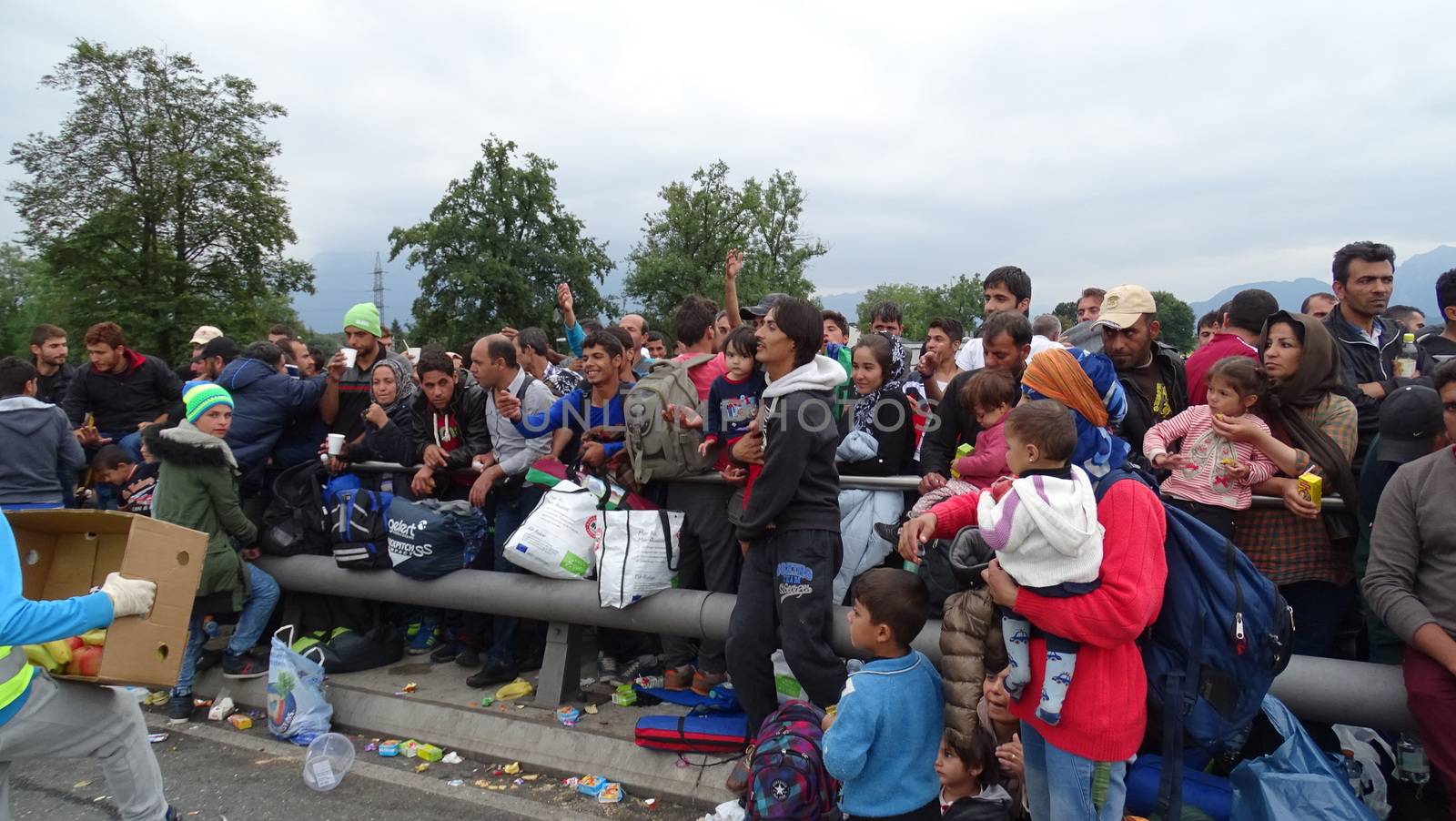 AUSTRIA, Salzburg: Scores line up at the border control in Salzburg, Austria on September 22, 2015 amid an ongoing refugee crisis, which has seen thousands flee from Syria and other war-torn countries for safety in Europe.