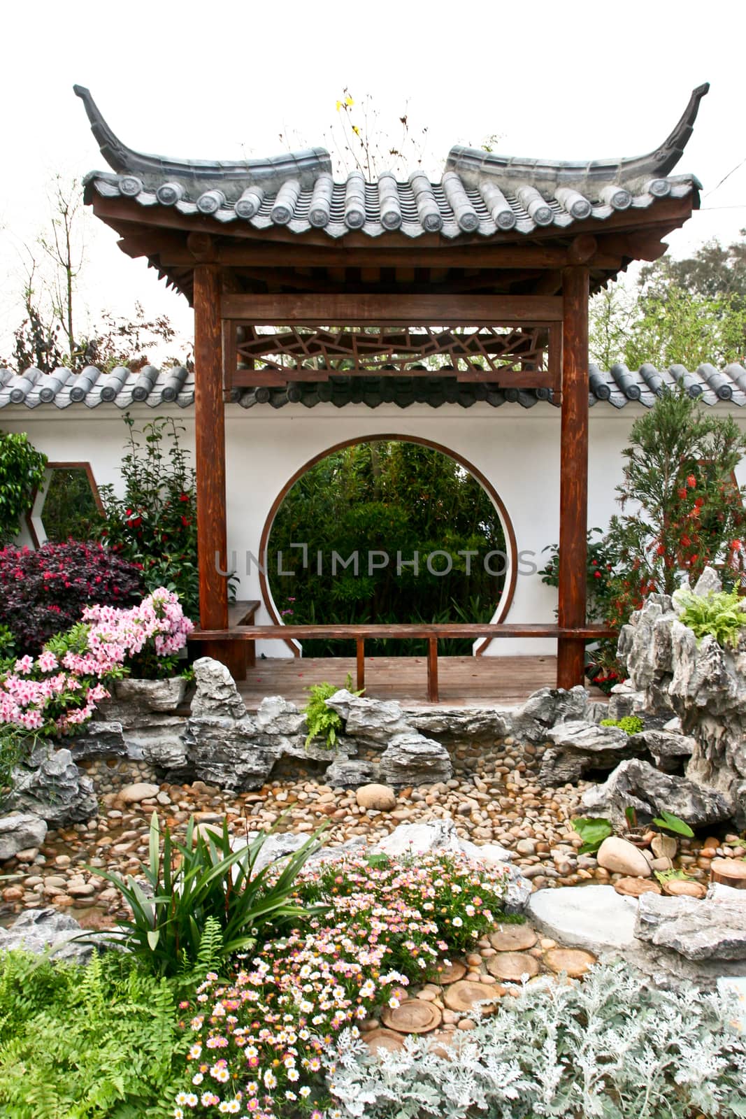 Chinese kiosk with stones and flowers