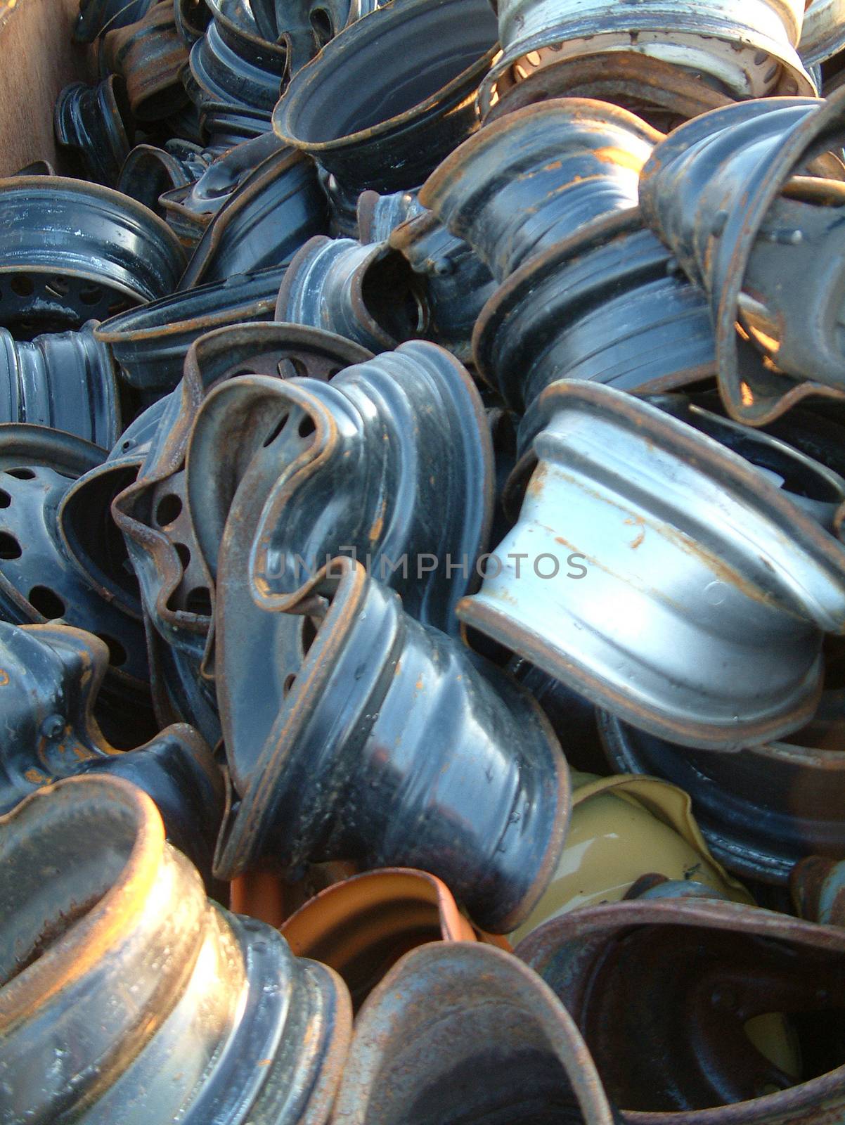 Broken wheels in atypical automobile scrap yard