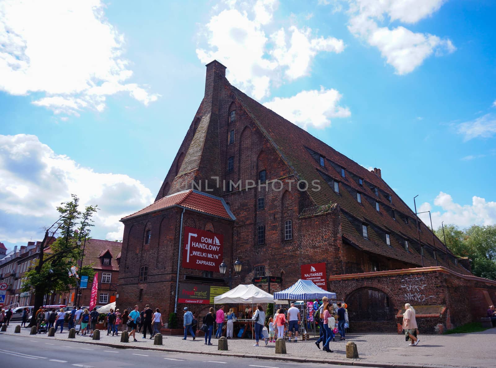 GDANSK, POLAND - JULY 29, 2015: People walking next to the old trade building at the city center