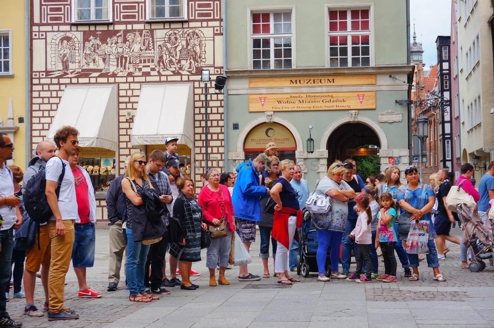 GDANSK, POLAND - JULY 29, 2015: Group of people looking at something in the city center